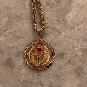 Elegant Gold Pendant Necklace with Red Gemstone